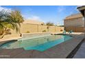 Inviting swimming pool with a tiled water feature and patio seating at 1278 E Geona Ct, San Tan Valley, AZ 85140