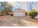 House exterior featuring a garage and well-maintained front yard at 15145 W Elko Dr, Surprise, AZ 85374