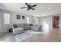 Living room with L-shaped sofa and access to backyard at 1631 E Paul Dr, Casa Grande, AZ 85122