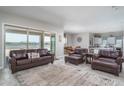 Open living area with leather furniture and a view to the kitchen at 18242 W Colter St, Litchfield Park, AZ 85340