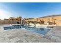 Inviting rectangular pool with a pergola and spacious patio area at 19042 W Clinton St, Surprise, AZ 85388