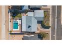 Bird's eye view of a house boasting a refreshing pool and a neatly kept backyard, ideal for outdoor relaxation at 2113 N 66Th St, Scottsdale, AZ 85257