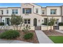 2-story townhome with front walkway and mature landscaping at 2477 W Market Pl # 55, Chandler, AZ 85248