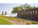 Anthem Del Webb community entrance with brick wall and landscaping at 2868 N Manassas Dr, Florence, AZ 85132