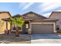 Inviting single-story home featuring a desert landscape and a two-car garage at 3129 W Fremont Rd, Phoenix, AZ 85041