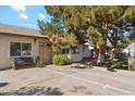 House exterior showcasing a double door entry and a large tree at 3432 N 86Th Ave, Phoenix, AZ 85037