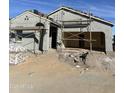 New home under construction with scaffolding and building materials at 38123 N Stallion St, San Tan Valley, AZ 85140