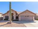 Single-story house with a two-car garage and desert landscaping at 4213 E Stanford Ave, Gilbert, AZ 85234