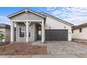 Well-maintained single-story home with neutral tones, accented by a stylish entry and garage door at 4412 N 203Rd Dr, Buckeye, AZ 85396