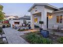 Outdoor patio with a fire pit, seating area, and beautiful landscaping at 4841 E Amelia Ave, Phoenix, AZ 85018