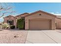 One-story house with a two-car garage and desert landscaping at 5077 S Barley Way, Gilbert, AZ 85298