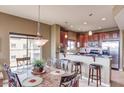 Kitchen and dining area with breakfast bar and granite countertops at 5350 E Deer Valley Dr # 4248, Phoenix, AZ 85054