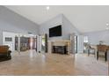 Spacious living area features a fireplace and tile flooring at 8028 E La Junta Rd, Scottsdale, AZ 85255