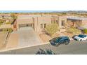 Beautiful home featuring a desert landscape with native trees and a neutral earth-tone stucco exterior at 8606 S 30Th St, Phoenix, AZ 85042