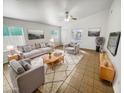 Bright living room featuring a neutral color palette and comfortable seating at 9023 W Hubbell St, Phoenix, AZ 85037