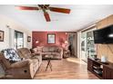 Living room with brown couches and laminate flooring at 9333 E University Dr # 86, Mesa, AZ 85207