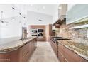 Spacious kitchen boasts granite counters & top-of-the-line appliances at 10410 N 74Th Pl, Scottsdale, AZ 85258