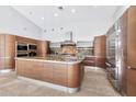 Modern kitchen with granite countertops and stainless steel appliances at 10410 N 74Th Pl, Scottsdale, AZ 85258