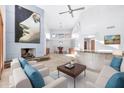 Bright living room featuring a fireplace and comfortable seating at 10410 N 74Th Pl, Scottsdale, AZ 85258