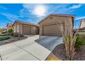 Two-car garage and well-kept landscape enhance this property's curb appeal at 10501 W Swayback Pass, Peoria, AZ 85383