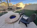 Fire pit and chairs in a landscaped backyard at 11340 E Stearn Ave, Mesa, AZ 85212