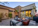 Cozy outdoor fire pit area with comfortable seating and desert views at 15949 E Ridgestone Dr, Fountain Hills, AZ 85268