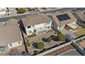 An aerial view of the backyard featuring desert landscaping, a patio, a small balcony, and a privacy fence at 18017 W Desert Ln, Surprise, AZ 85388