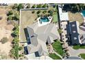 Aerial view of a home with a pool, patio area, verdant yard, and mature trees in a Gathering-friendly neighborhood at 2222 N Val Vista Dr # 2, Mesa, AZ 85213