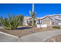 Single-story home with a two-car garage and desert landscaping at 23306 S 221St St, Queen Creek, AZ 85142