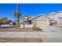 Single-story home with a two-car garage and desert landscaping at 23306 S 221St St, Queen Creek, AZ 85142