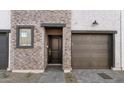 Front door and entryway with access to garage and closet at 2821 W White Feather Ln, Phoenix, AZ 85085