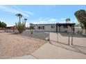 Charming single-story home featuring desert landscaping and a gated entrance at 358 N 82Nd Way, Mesa, AZ 85207