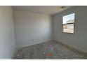 A bedroom with white walls and a window providing natural light at 47733 W Moeller Rd, Maricopa, AZ 85139