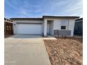 A single-story home with a two-car garage and a neutral color scheme is shown at 47733 W Moeller Rd, Maricopa, AZ 85139