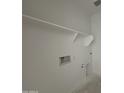A laundry room featuring a shelf, electrical outlets, and water connections at 47733 W Moeller Rd, Maricopa, AZ 85139