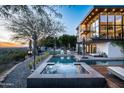 Expansive pool and spa with city views at sunset at 5419 E Valle Vista Rd, Phoenix, AZ 85018