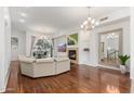 Living room featuring hardwood floors and a fireplace at 6605 N 93Rd Ave # 1070, Glendale, AZ 85305