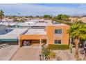 Birds eye view of a southwest-style stucco home with carport and lush desert landscaping at 7844 E Coolidge St, Scottsdale, AZ 85251