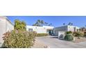 Landscaped home exterior with driveway and desert foliage at 8708 E San Lucas Dr, Scottsdale, AZ 85258