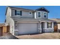 Charming two-story home featuring stone accents, neutral paint and an attached two-car garage with brick paver driveway at 9036 S 196Th Dr, Goodyear, AZ 85338