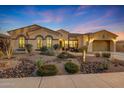 Beautiful single-story home with desert landscaping and a three-car garage at 18125 W Acacia Dr, Goodyear, AZ 85338