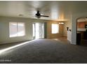 Open floor plan, combining living and dining areas with kitchen access at 21963 W Gardenia Dr, Buckeye, AZ 85326