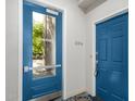 Apartment entry doors with modern blue paint and glass at 2989 N 44Th St # 1004, Phoenix, AZ 85018