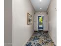 Building hallway with carpeted floor and modern wall decor at 2989 N 44Th St # 1004, Phoenix, AZ 85018