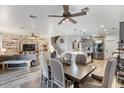 Open concept dining area with farmhouse style table and chairs at 38100 W Santa Clara Ave, Maricopa, AZ 85138