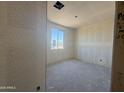 Bedroom with drywall walls and a bright window offers a simple yet elegant space at 4517 S 95Th Dr, Tolleson, AZ 85353