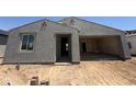 Home exterior showcases stucco and an open garage ready to be converted into a livable space at 4517 S 95Th Dr, Tolleson, AZ 85353