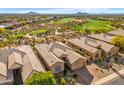 Beautiful aerial view of the home showcasing desert landscaping and golf course in the community at 9523 E Sandy Vista Dr, Scottsdale, AZ 85262