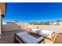 Spacious rooftop deck boasts comfortable seating and scenic views at 1950 W Desert Hollow Dr, Phoenix, AZ 85085