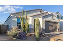 New construction home with desert landscaping and a two-car garage at 2038 E Dry Wood Rd, Phoenix, AZ 85024